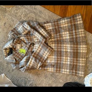 Never been worn, still has tags on it.